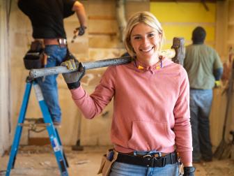 Demolishing the Legg kitchen puts a smile on host Jasmine Roth's face, as seen on HGTV's Hidden Potential.