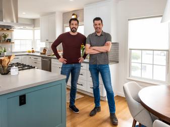 Jonathan and Drew pose in Monica and Adrian's kitchen, as seen on Property Brothers: Forever Home