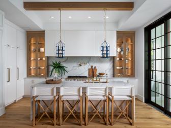 Modern pendants in contemporary kitchen with marble island